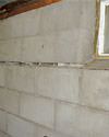 Severely buckling foundation walls in a home in Clarence in need of repairs.
