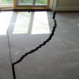 a huge crack in a concrete slab floor in Lockport