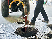 Digging the hole used for wall anchor installation in Attica.