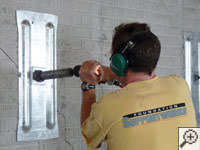Mounting the steel wall plate for foundation wall repair and straightening in Attica.