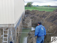 Drilling the hole in the foundation wall for street creep repairs in Derby