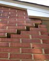 Serious damage to a foundation wall due to settlement of a home in Eden