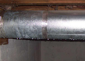 condensation collecting on an HVAC vent in a humid Lewiston basement