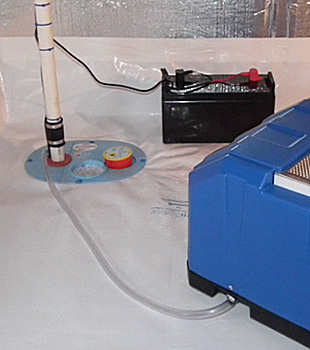Closeup of a crawl space sump pump installed in Depew
