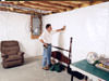 A basement wall covering for creating a vapor barrier on basement walls in Alden