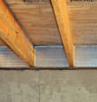SilverGlo™ insulation installed in a floor joist in East Aurora
