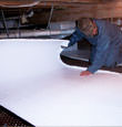 Hamburg insulation being installed in a crawl space.