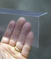 Closeup of a clear plastic covering on a Depew crawl space block wall