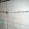Severe foundation damage from a long crack in a bucking wall of a East Amherst home.