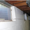 A foundation showing severe inward buckling along the windows in a Alden home.