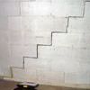 A diagonal stair step crack along the foundation wall of a Angola home