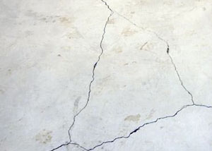 cracks in a slab floor consistent with slab heave in Angola.