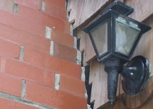 A tilting chimney in Lewiston showing serious foundation damage.