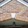Major tuckpointing on a home archway over a door, with tuckpointing several inches wide that has failed on a Buffalo home