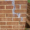 Tuckpointing that cracked due to foundation settlement of a Niagara Falls home