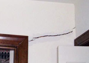 A large drywall crack in an interior wall in Henrietta