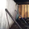 Temporary foundation wall supports stabilizing a Tonawanda home