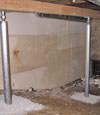 A system of crawl space support posts adding structural support to a crawl space in Collins
