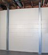 A steel i-beam system installed on a Cheektowaga, West Seneca, Dunkirk foundation wall