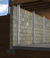 I-beam foundation wall supports installed in a Gowanda basement.