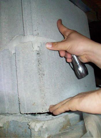 a completely failing concrete crawl space support pillar in Collins
