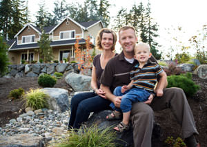 A happy family outside a home with a repaired foundation in Springville