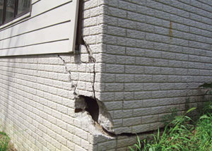 A severely damaged foundation wall in Orchard Park