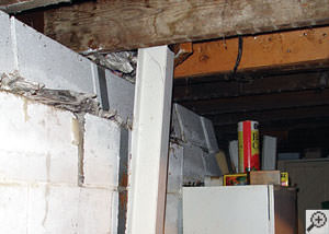 A failing foundation wall and i-beam support in a Buffalo home