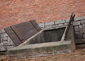 An open hatchway door in Attica that's flooded.