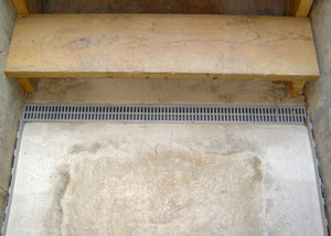 Our grated drain system installed on a leaking basement staircase in Newfane.