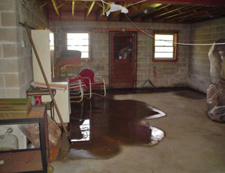 a flooded basement floor in a Collins home