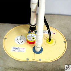 A sump pump system installed along a basement floor in Buffalo.