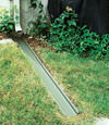 A recessed gutter drain extension installed in Collins, Western New York