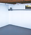 Rochester, NY wet basement wall covering that tucks into a perimeter drainage system