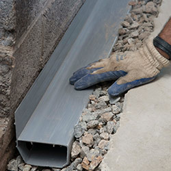 installing a drain tile system in a Clarence home